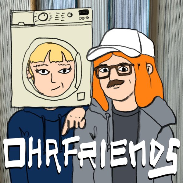 Cover für Ohrfriends, Comiczeichnung: Stella mit Waschmaschinenkopfmaske, Kuba mit langen rot-orangen Haaren.